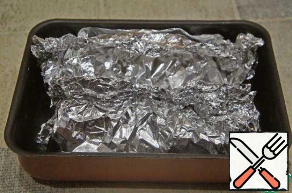 Repeat the operation with the second fish. Put both fish on a baking sheet. Bake in the oven (180*C) for 20-25 minutes.