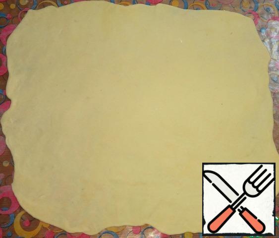 Roll out each part of the dough very thinly.