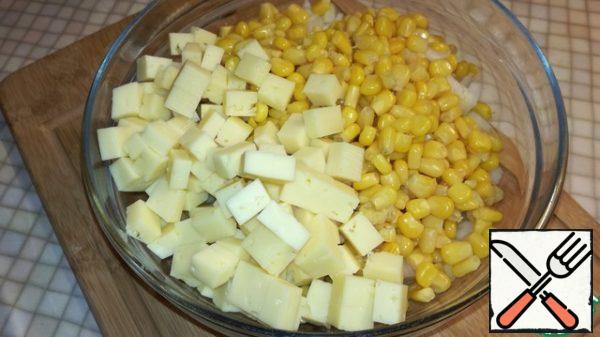 Cheese cut into medium cubes. Pour into a bowl.