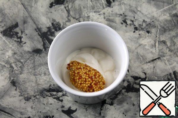 Mix sour cream with grainy mustard.
