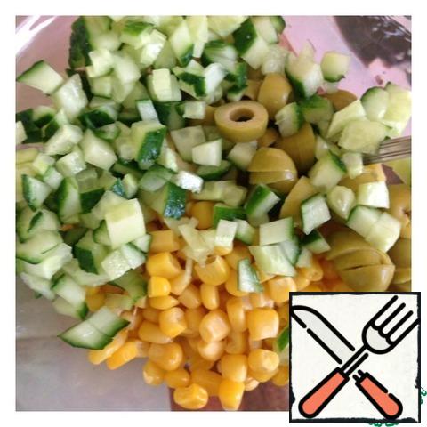 Cucumber cut into small cubes, olives slices. Add the corn.