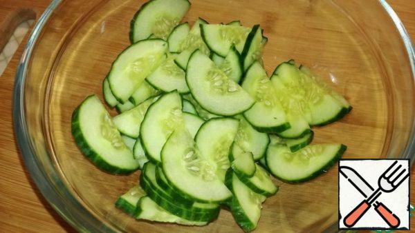 Wash the cucumber and cut into circles or semi-circles if desired.