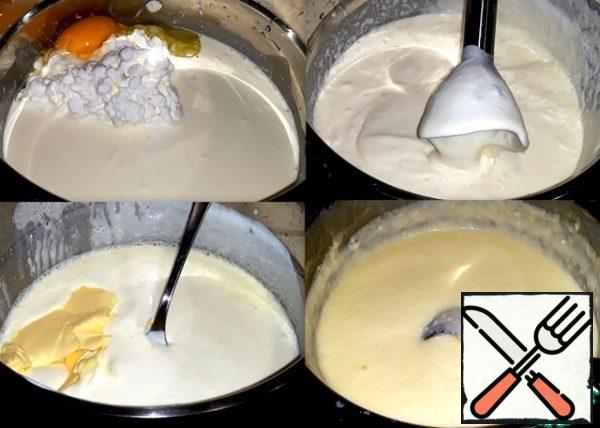 She poured cream into a saucepan with a thick bottom.
Pour cream into the cottage cheese, break the egg
and add salt. Whisk everything with a hand blender
until smooth. Put the pan
on a low heat and stir constantly.
As soon as the contents of the pan are heated,
put the oil and pour in the soda. Cooked cheese
10 minutes on low heat, until thickening.
