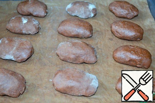 Place the dough seam down on a covered baking sheet.
