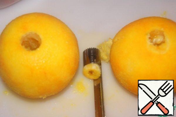 Cut off the core from the side of the stalk, which connects the orange slices.
