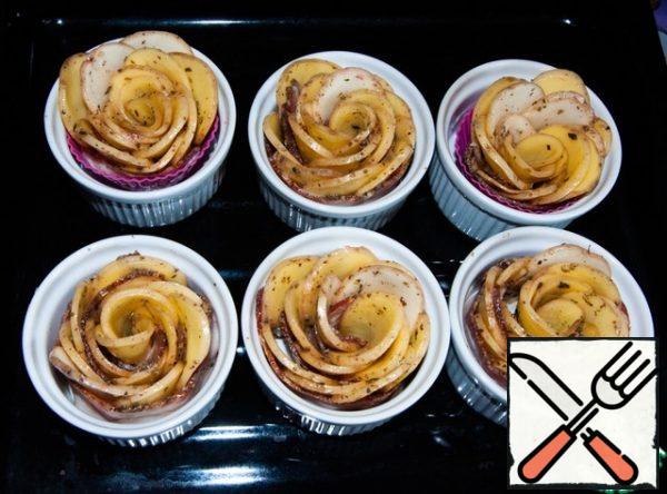 Place the potato rosettes in greased muffin pans. Bake the potato rosettes in the oven for 20 minutes. Then cover the roses with foil and bake for about 30 minutes.