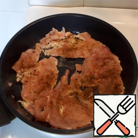 Beat the chicken fillet thinly, sprinkle with spices what you like, I took for potatoes. Fry in a hot pan on both sides until tender.