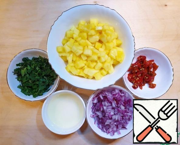 Mango and red onion cut into small cubes.
Chop the greens.
Squeeze the juice from half a lime.