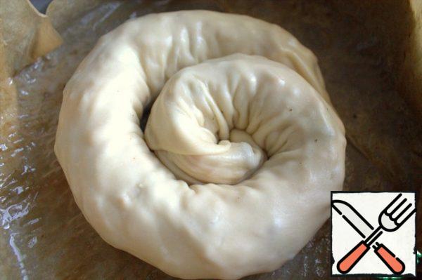 Transfer to a deep frying pan or baking dish. I covered the mold (24 cm in diameter) with oiled parchment.

