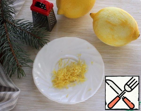 Wash the lemons, dry them, grate the zest with 2 lemons.