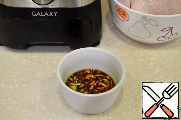 Add the crushed zest and garlic to the soy sauce.