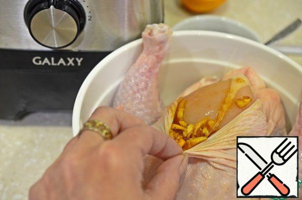 Brush the chicken with marinade, paying special attention to the meat of the breast under the skin.