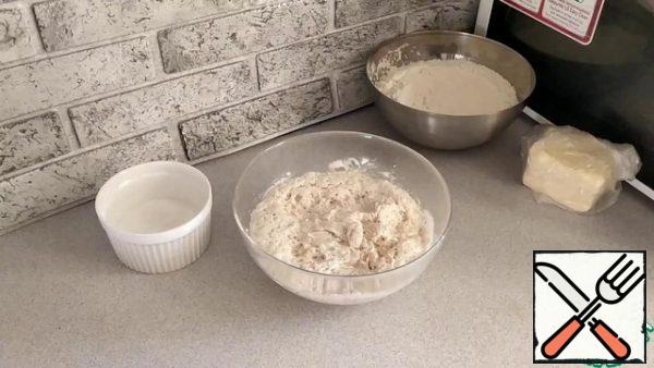 In the finished brew, add the remaining sugar and salt. Mix well and slowly begin to pour 1/2 of the remaining flour.