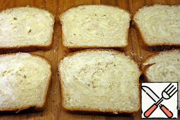 On slices of bread we put a thin layer of butter on one side.
