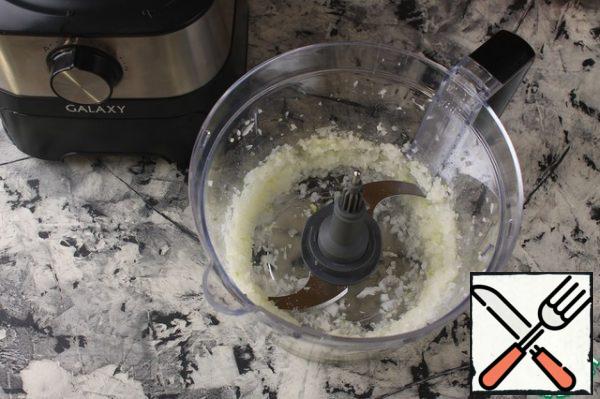 Chop the onion in a food processor.