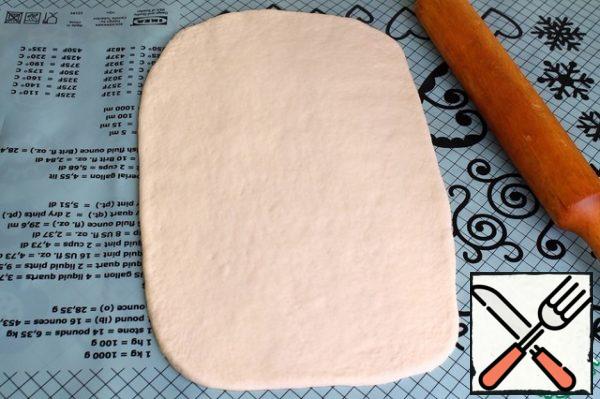 Roll out the dough into a rectangle.
