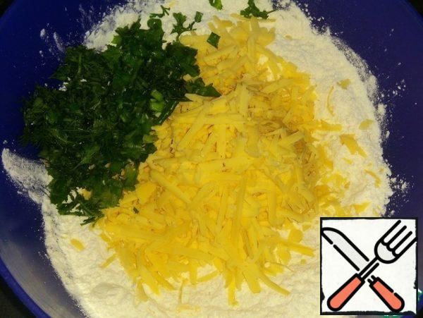 Mix the flour with salt, baking powder, chopped herbs (I have dill, parsley, green onions) and grated cheese.