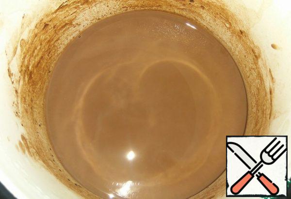 Mix the milk, sugar and cocoa in a small saucepan and bring to a boil. Remove from heat. Pour into a tall glass.