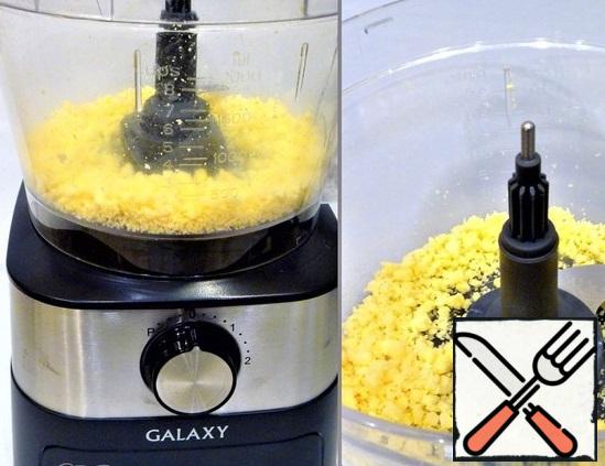 In a food processor (attachment knife for chopping), chop the cheese into small crumbs, put on a plate.