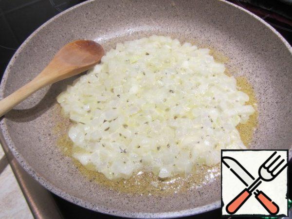 Melt the butter, chop the onion and fry it until transparent.
