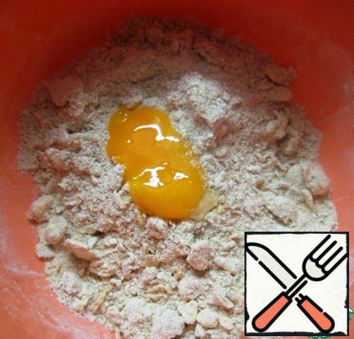 RUB the flour and butter into crumbs with your hands. Add the yolk.