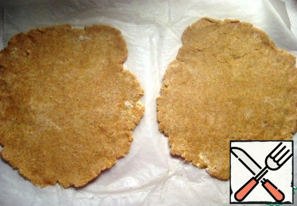 Roll out each piece on a sheet of parchment.
