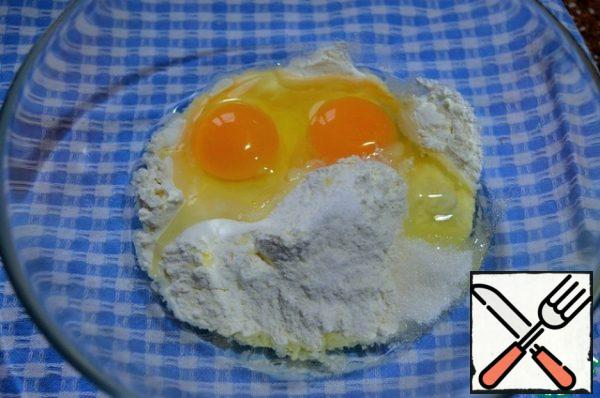Mix flour with sugar, salt, add eggs.
