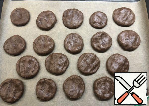 Spread the balls on the parchment and flatten to form a cookie. Bake at 180 degrees for 10-12 minutes.