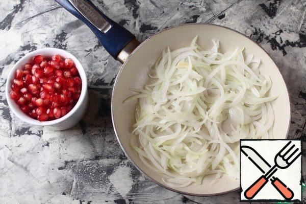 Fry the onion in vegetable oil until soft. Add the pomegranate seeds and simmer for another 3-4 minutes.