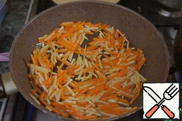 Fry the carrots and celery until half cooked.