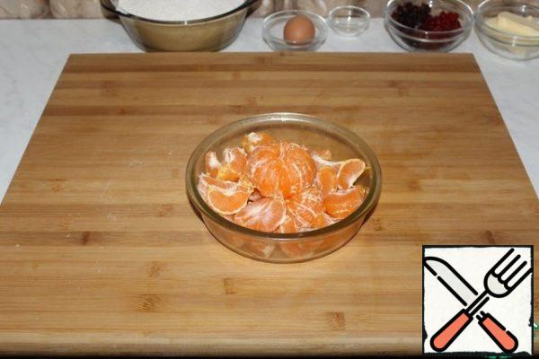 Carefully peel the tangerines.