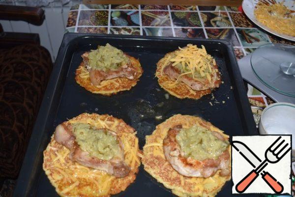 Put the meat on the pancakes. Put cucumbers with mustard on the meat. Sprinkle everything with the remaining cheese and put it in the oven for 15-20 minutes.
