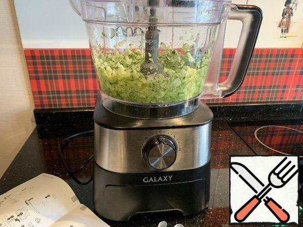 Use a food processor to chop cucumbers and dill.
