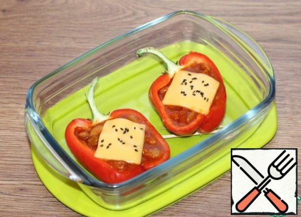 Sprinkle the filling with grated cheese or garnish with a plate of melted cheese and return to the oven until the cheese melts. Sesame seeds are optional.
