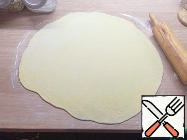 It is more convenient to roll out the dough in 2-3 passes.