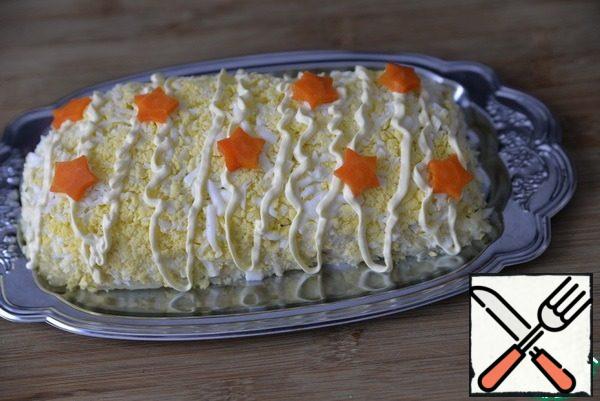 You can decorate according to your taste and desire. I applied strips of mayonnaise and decorated them with stars of boiled carrots.
