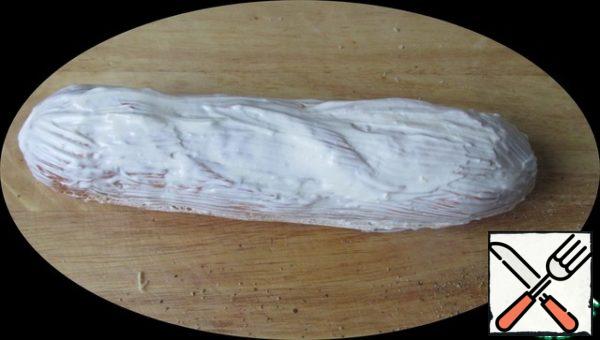 Cover with the top half and smear the whole baguette with sour cream mixture from the sides and top.