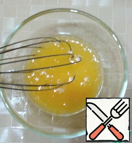 In a separate container, combine the water, yolk, sugar, and salt. Stir.