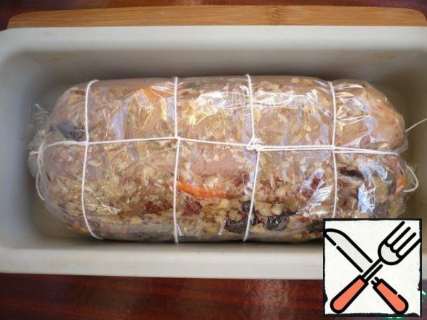 Transfer the chicken roll to a baking dish (size 25x11). Put in the oven at 150 degrees for 1 hour.