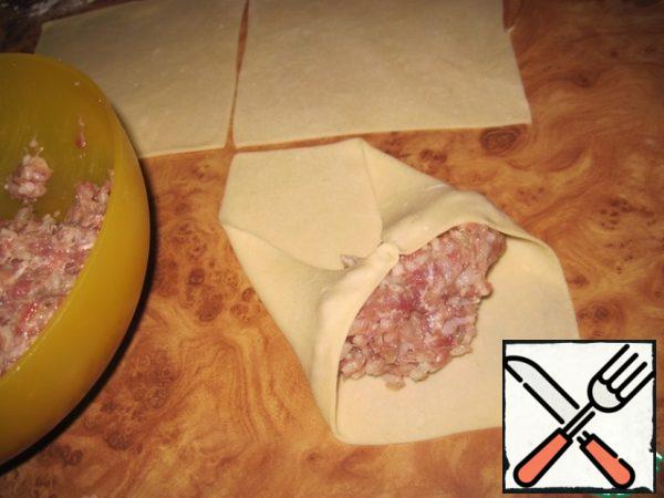Roll out the dough very thinly (1 mm). Cut into squares of 10 * 10 cm. put 1 tbsp of filling on the corner of the square. Wrap like stuffed cabbage, or dolma.
