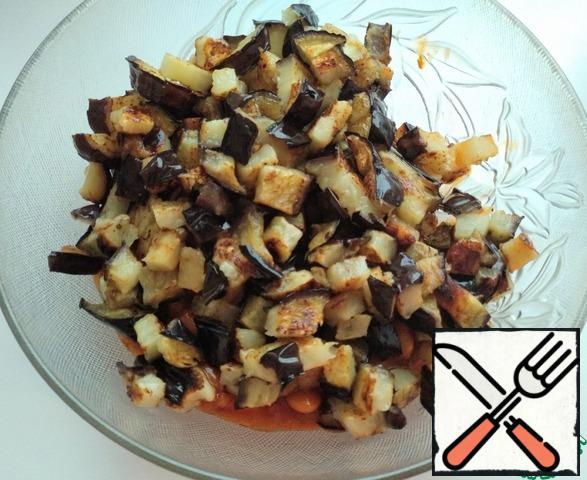 Cut eggplant slices into cubes and add to the beans.