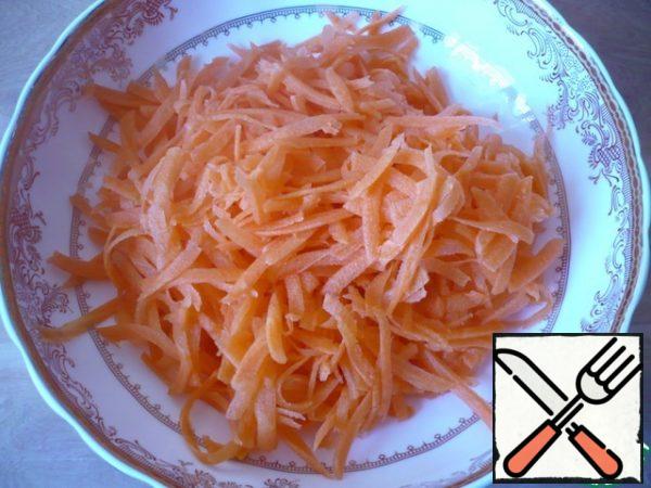 Carrots are also cleaned and grated on a large grater.