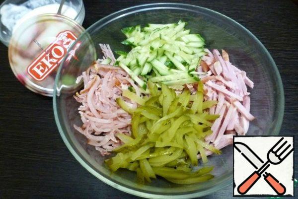 Cut into strips meat products, fresh cucumber, pickles .
