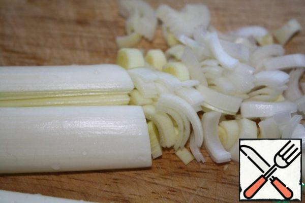 Cut the white part of the leek in half and then into quarters, and finely chop.