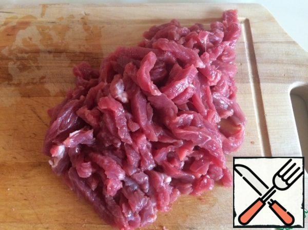 Cut the beef into strips and send it to stew until tender. Add salt just a little. It took me just over 1 hour.