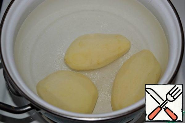 Boil the potatoes until tender.
