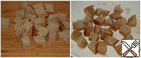Bread (any white bread) cut into cubes and quickly fry until Golden brown in the same pan where the bacon was cooked.