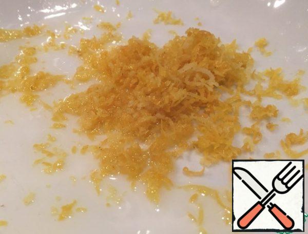 In a bowl, grate the lemon zest, half the juice and add the vinegar.