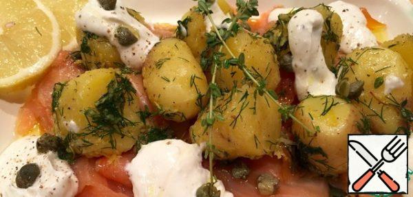 Drizzle with olive oil. Add sour cream and horseradish sauce... I add a few mint leaves and a tablespoon of capers.