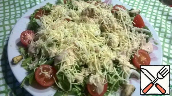 Pour the sauce over the salad.
Sprinkle with grated cheese on top.